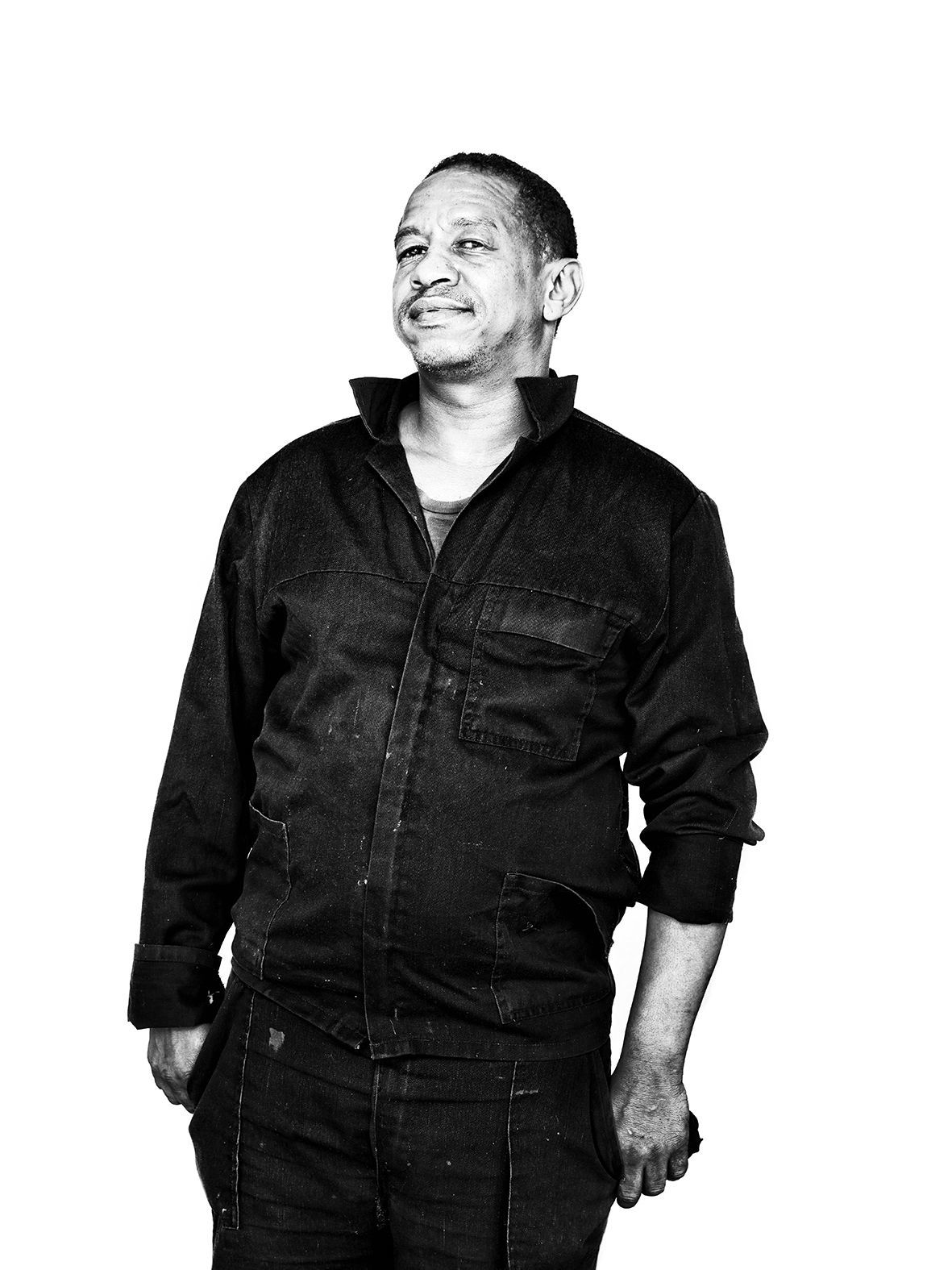 Black and white Portrait of a mechanic in Cape Town wearing his working gear.