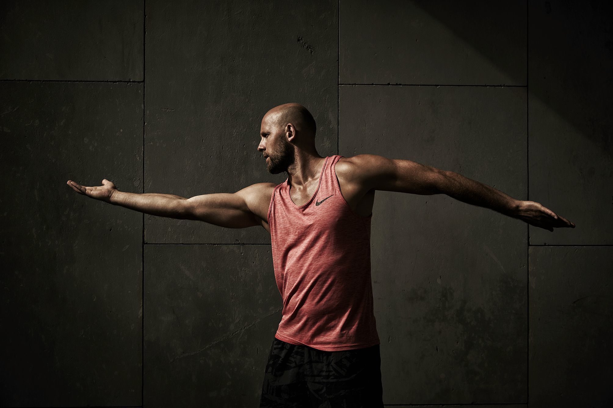 Fitness trainer showing some stretching routines on a bench in Berlin