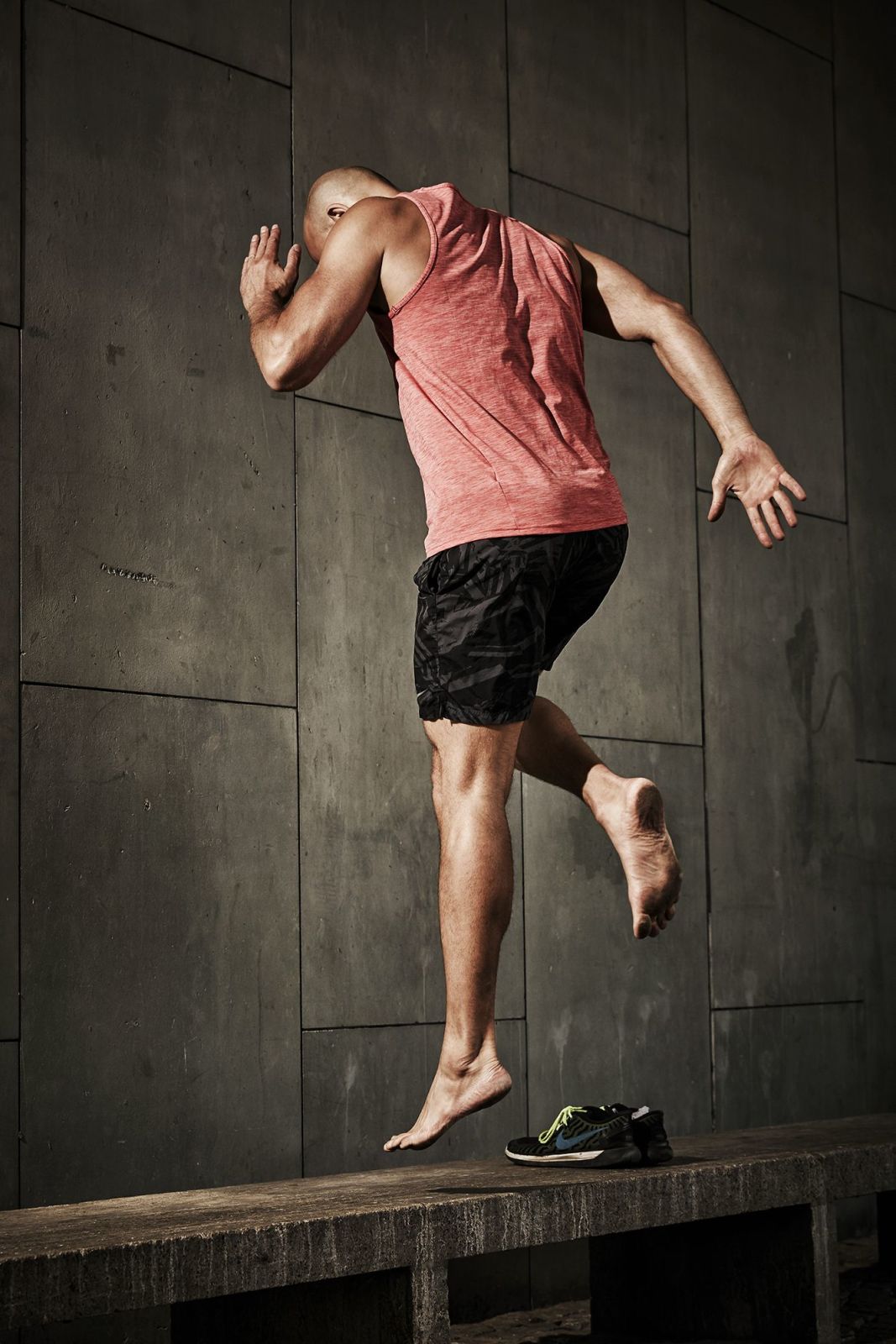 Fitness trainer showing some fitness routines on a bench in Berlin