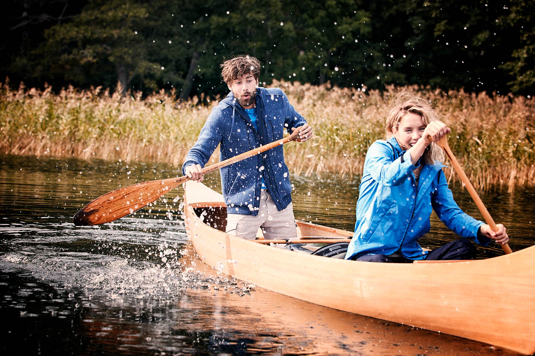 Nicklas and Hanna canoeing in a lake near Stockholm, Nicklas by mistake splashing water at Hannah sitting in front of him in the canoe.
