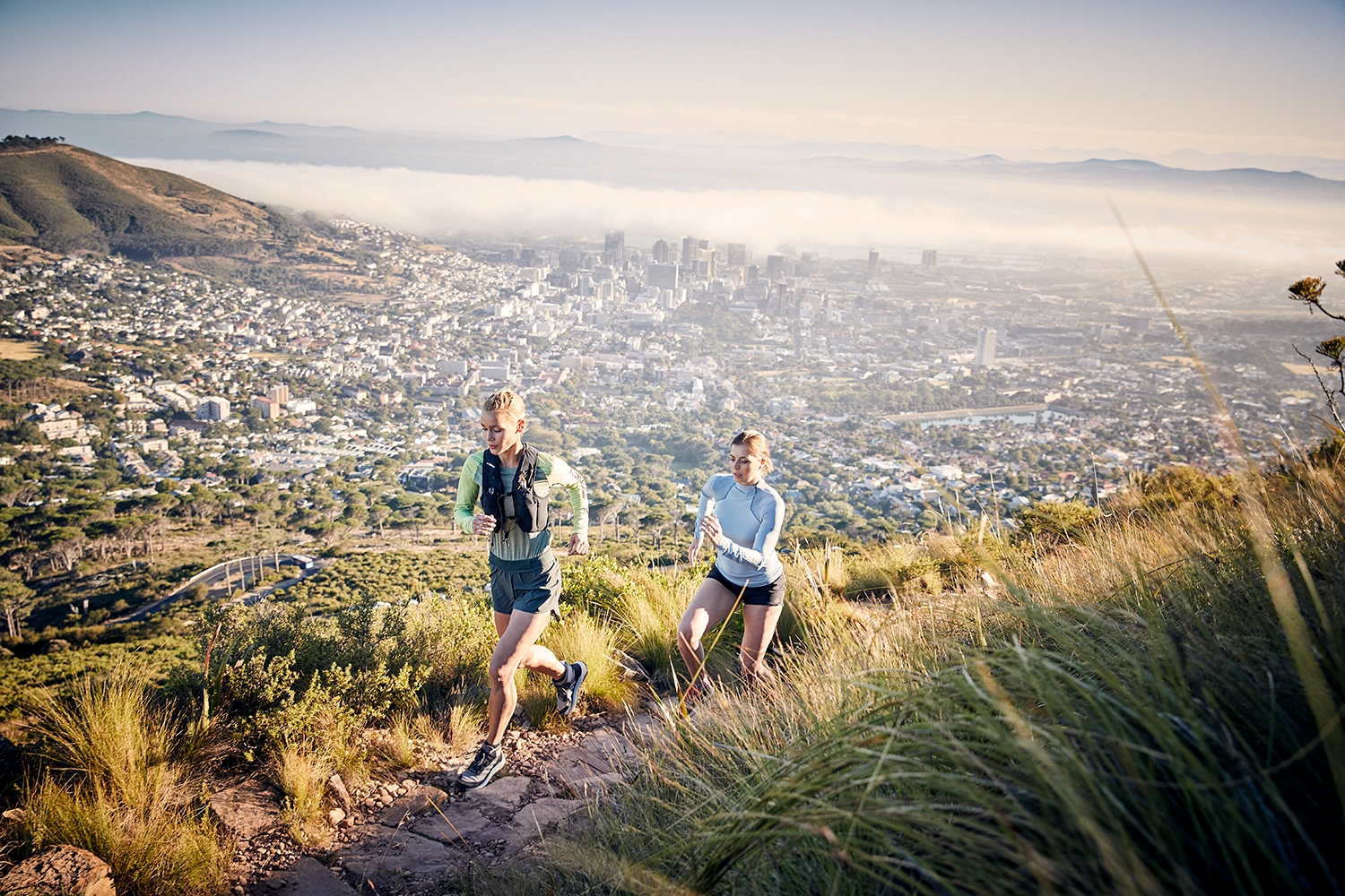Two young athletes trailrunning in Cape Town