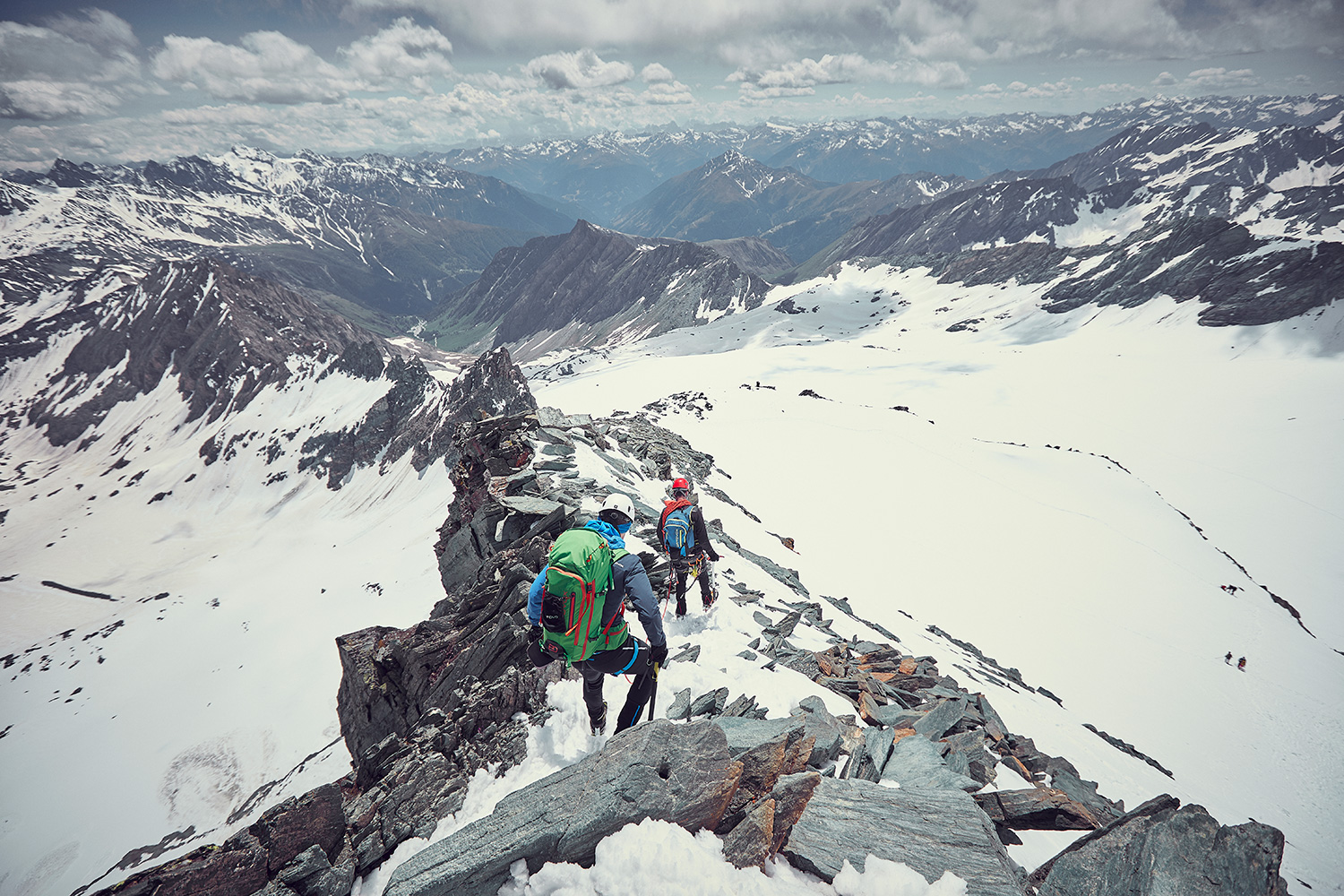Two mounaineers on ropes making their way down from the Grossglockner Summit