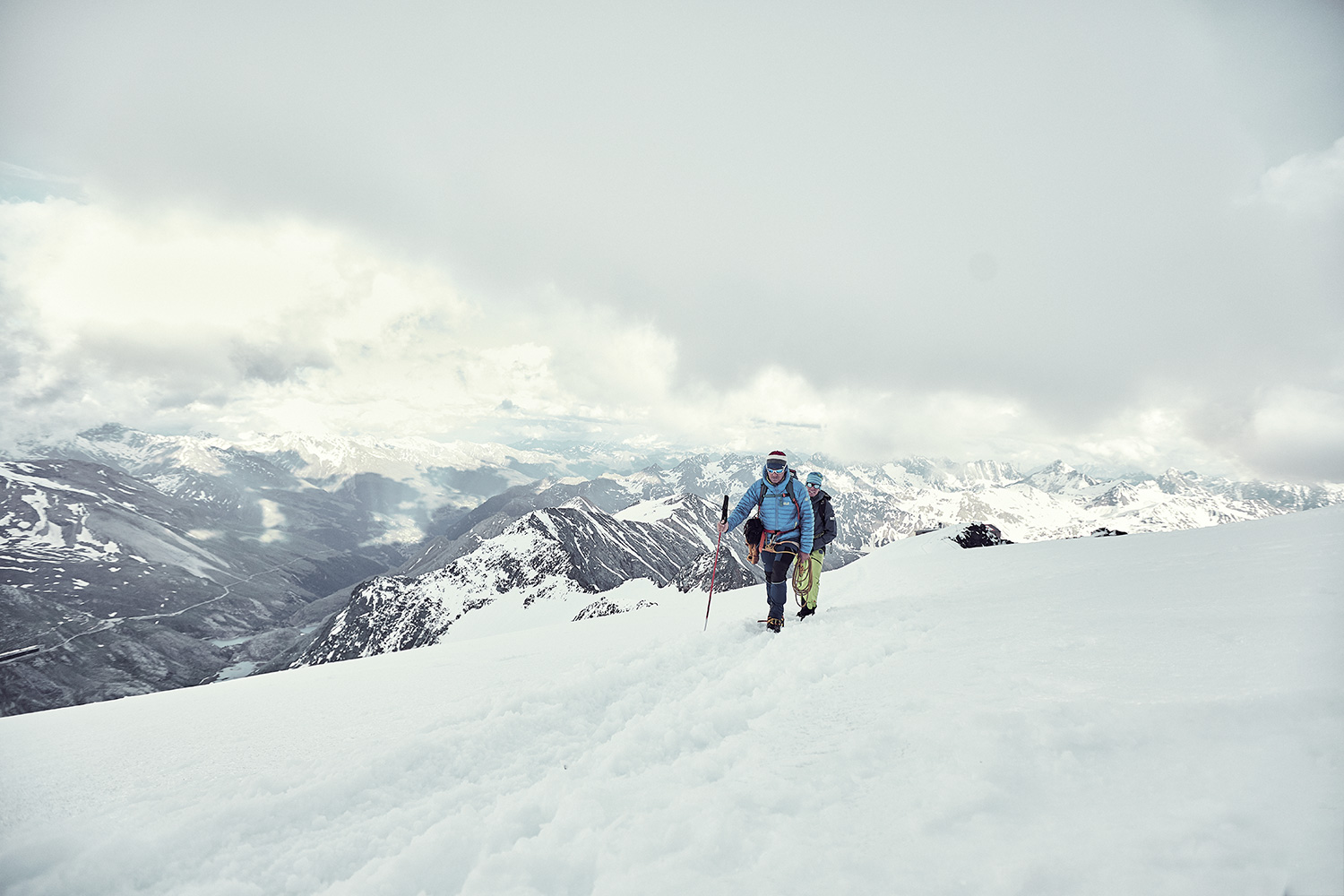 Two mountain guides making their way through the snow up to Grossglockner summit