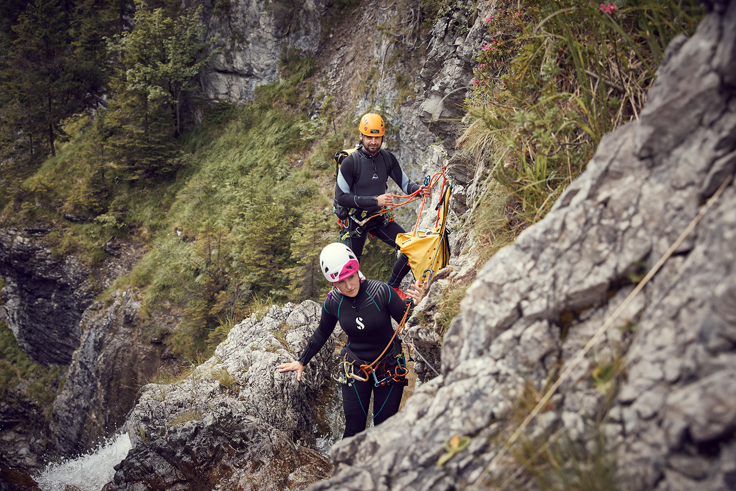 Kim and Ronnie securing the absseiling ropes at a canyoning tour in Austria