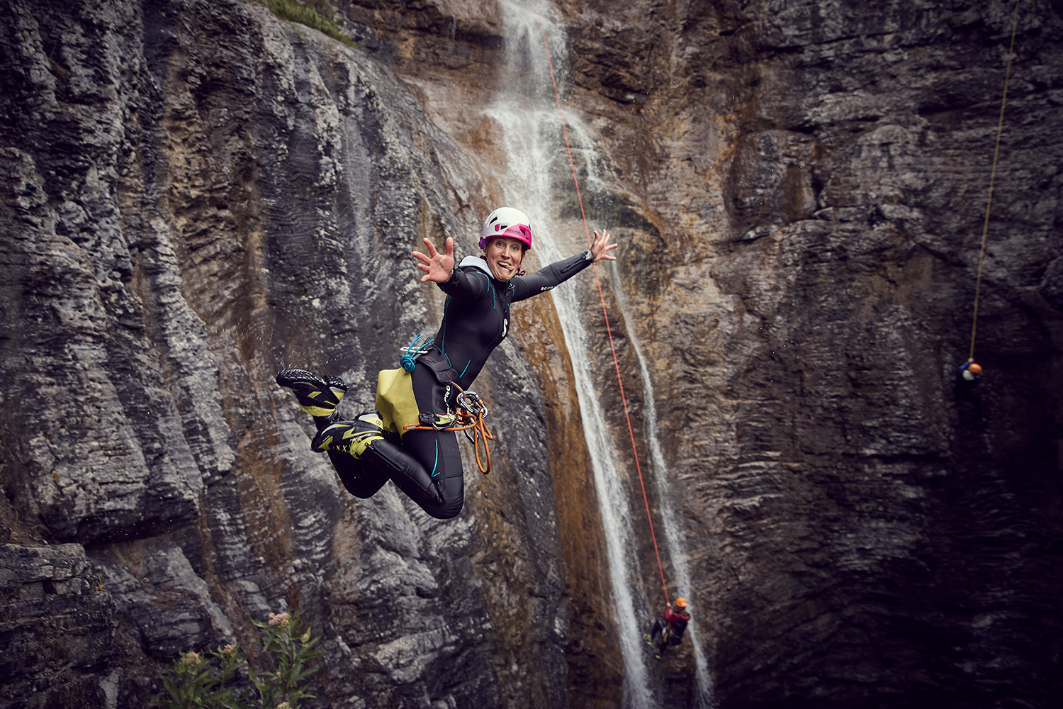 Stunt woman Kim jumping into a pool while canyoning in Austria