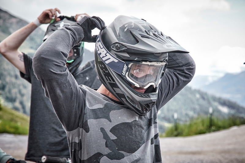 Portrait of a Mountainbiker fixing his goggles