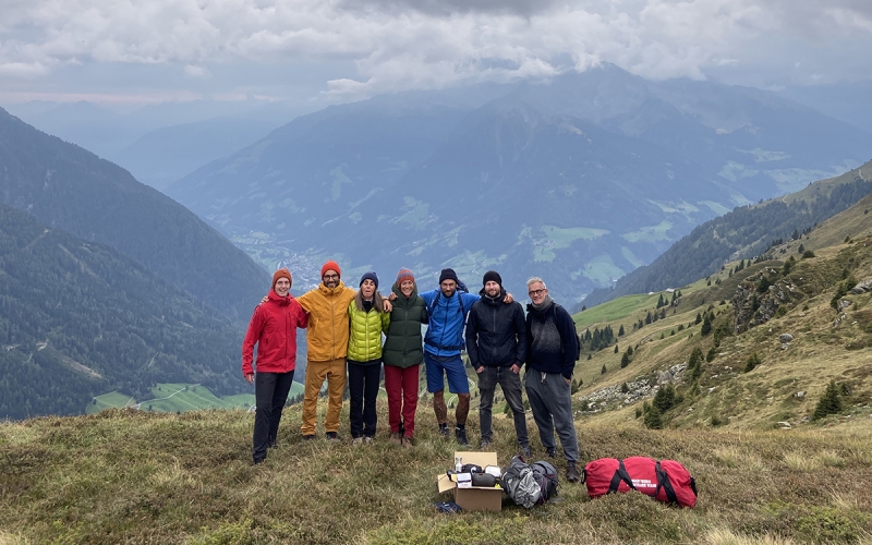 Photo Team for TATONKA Catalogue Shoot with Jessica Zumpfe on top of the mountain in the dolomites