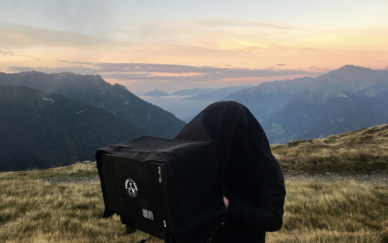 iworkcase on the top of the mountains in the dolomites on a shoot for TATONKA for Jessica Zumpfe