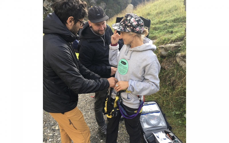 Jessica Zumpfe being prepped for a via Ferrata by her assistants on a shoot for TATONKA