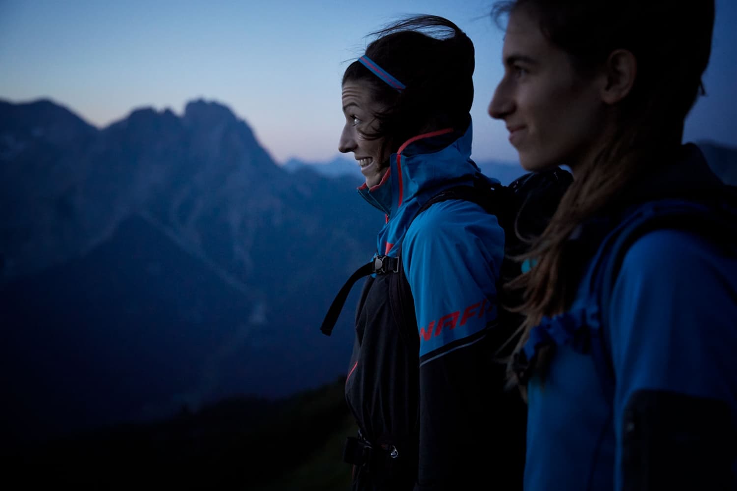Two women excited to climb the mountain in the dark to get to the summit at sunrise