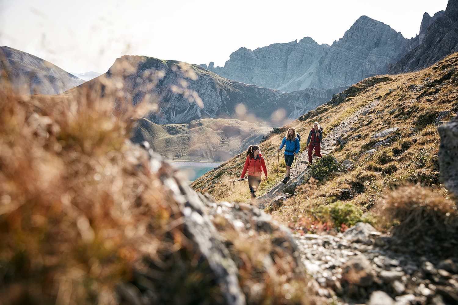 Three friends hiking in the mountains at Axamer Lizum